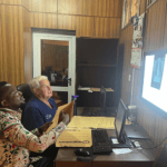 two men reviewing a radiograph in a reading room